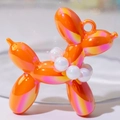 Balloon dog charm in orange and pink gradient finish with iridescent metallic luster - Iridescent Orange