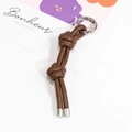 Portachiavi minimalista in pelle intrecciata marrone scuro con anello a molla argento - Marrone scuro