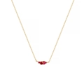 Close-up of gold titanium necklace with a cluster of five deep red round gemstones - July