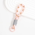 Plüsch-Strick-Handschlaufe mit rosa-orangefarbenem Karomuster und Metallverschluss - Hellrosa