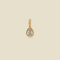 Elegant gold pear-cut crystal pendant with bezel setting on a neutral cream background - Teardrop Pendant