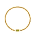 Detail of gold beaded bracelet featuring a rectangular olive green gemstone setting - August