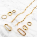 Gold plated link chain necklace with spring ring clasp and textured charms on marble - No.5 Open Link Necklace