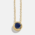 Minimalist gold necklace featuring a round bezel-set deep blue sapphire gemstone - September Sapphire Blue (9)