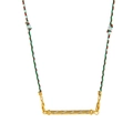 Close-up of golden tarot pendant with sparkling stones on a tricolor woven rope - Spiral Stone Decor / Yellow