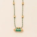 Detail of evil eye pendant with green enamel and colorful braided cord chain - Green Eye Kaleidoscope