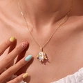 18K gold plated necklace featuring a cute penguin pendant with pearl and blue gem - Penguin Necklace