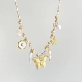 Detail showing shell starfish butterfly pendants on a woven cord bohemian necklace - Butterfly White Rope Style