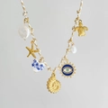 Detailed view of colorful cord necklace with sea turtle starfish and evil eye charms - Conch White Rope Style
