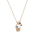 Detailed view of a gold-tone cupcake pendant with white pearl and star gemstones - Cupcake Necklace