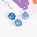Three iridescent blue lotus seed and bird charms for DIY jewelry and phone chains - Transparent Dark Blue