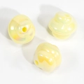Three spiral-shaped light yellow iridescent pearlescent beads for DIY jewelry making - Spiral Swirl Bead / Solid Yellow