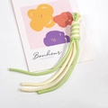 Braided phone wrist strap in green and beige featuring a spiral knot and durable cord - Cream and Fruit Green