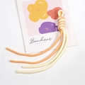 Two-tone woven wrist strap in cream and coral pink with spiral knot design for phones - Cream and Light Orange