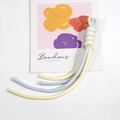 Two-tone woven phone wrist strap in light yellow and blue with spiral knot design - Cream and Light Aqua Blue