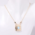 Collana con ciondolo a libro dorato con opale blu e stelle incise su busto - Collana Album Fotografico Voto Oro