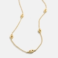 Minimalist gold titanium steel necklace featuring multiple evil eye charms and golden beads - Evil Eye