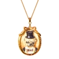 Macro detail of vintage gold pug pendant with bow tie and hat on a twisted rope chain - Gold Pug Necklace