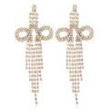 Detail of long gold tassel earrings with sparkling rhinestones in a butterfly bow shape - White KC Gold
