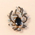 Vintage gold coral brooch featuring a large black teardrop crystal and sparkling rhinestones - Black Antique Gold