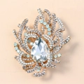 Elegant gold vintage brooch with pear-shaped crystal and light blue rhinestone details - Antique Gold with White Rhinestone
