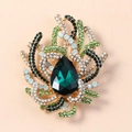 Vintage gold brooch with a large pear-shaped green gemstone and colorful rhinestones - Antique Gold Green