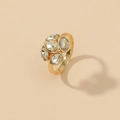 Elegant gold cluster ring with pear and marquise cut diamonds on a beige background - Clustered Gemstone Style (WR223)