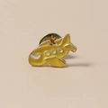 Detailed view of a cute yellow cartoon airplane enamel pin with gold metal framing - Yellow Airplane Style (WBR069)