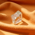 Chunky transparent acrylic ring in geometric irregular design on orange fur background - One Size