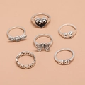 6-piece vintage silver ring set with heart skull butterfly and dice designs on peach background - Antique Silver