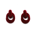 Macro shot of deep red velvet geometric drop earrings with interlocking circles - Dark Red