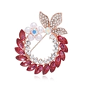 Macro shot of elegant floral brooch with red marquise crystals and white pearls - Fuchsia Rose Gold