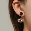 Minimalist evil eye drop earrings with gold plating and white rhinestones on model - Black Eye Drop