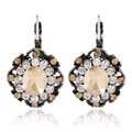 Detailed close-up of vintage leverback earrings with champagne stone and crystal halo - Champagne
