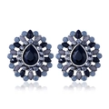 Detailed macro view of vintage bohemian water drop earrings with blue resin stones - Silver Black
