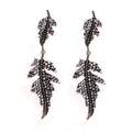 Macro shot of double-layered leaf earrings with sparkling grey rhinestones in retro style - Bright Black Antique KC Gold