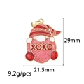 Detailed macro view of XOXO gnome enamel charm with pink glitter and gold trim - Pink and Red (ZX258)