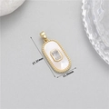 Detail view of oval gold pendant with white shell inlay and zircon measuring 27.37mm - Oval Mother of Pearl Zirconia Pendant Only (Without Chain) (H-12101) / Gold
