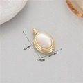 Detailed macro view showing the size and weight of a gold-plated oval mother-of-pearl pendant - Oval Mother of Pearl Pendant Only (Without Chain) (H-12102) / Gold