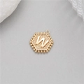 Detail shot of a 14K gold plated hexagonal pendant with embossed letter W and beaded edge - Letter W (P24279-W)