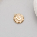 Detailed macro of 14K gold-plated initial U pendant with textured finish and beaded edge - Letter U (P24278-U)