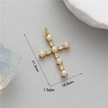 Macro shot of gold cross pendant with white pearls and zircons measuring 31.3x18.6mm - Full Rhinestone Artificial Pearl Cross Style (H-11684)