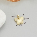 Macro shot of gold bow pendant with sunburst texture and precise 14.1x13.1mm dimensions - 14K Gold Style