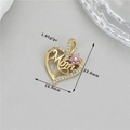 Detail of Mom heart pendant with white zircon pavé and pink flower on gold metal - Hollow Mom Heart (h-12593)