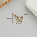 Macro detail of bow pendant with colorful zircons and size markings 13.37mm x 11.7mm - Gold Style 11