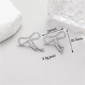 Detailed macro view showing bow earring dimensions 26mm x 30.3mm with zircon inlay - Palladium Plated Bowknot Accessory Style (CTWX190)