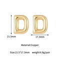 Detail view of gold letter D balloon earrings made of polished copper measuring 21.5mm - 14K Gold Bubble Letter D Stud Earrings (D2027)