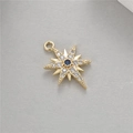 Detailed view of a gold polar star pendant with blue gemstone and zircon inlay - North Star Burst Style (H-3722)