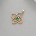 Close-up of vintage hollow gold pendant with green faceted gemstone and floral details - Hollow Window Style (14k Gold Plated H-2600 Green Zircon)