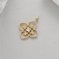 Detailed view of a gold clover pendant with milgrain edges and a sparkling center zircon - Hollow Clover Style (14k Gold Plated H-2600 White Zircon)